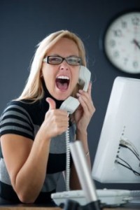 Woman on phone smiling with thumbs up